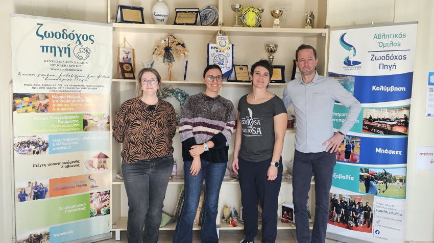Interns at internship placement in Crete, Greece, pictured with representatives from the host organization.