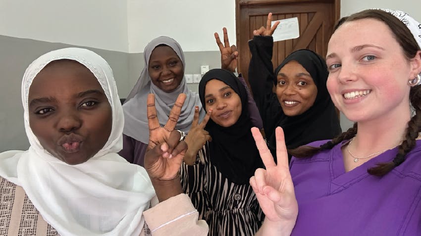Psychology intern in Zanzibar, at the mental health internship placement, posing with local staff members, Intern Abroad HQ