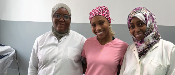 Randi, a Pre-Dentistry student from the United States, poses with medical staff in Zanzibar, during her international dental internship with Intern Abroad HQ