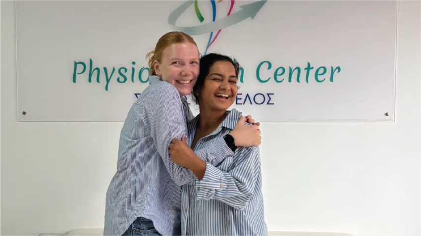 Two Physical Therapy interns are hugging