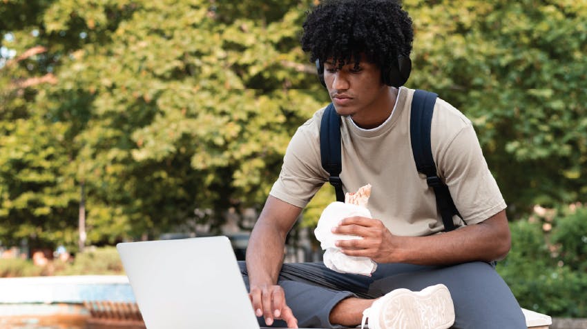 A student uses his computer during a study break