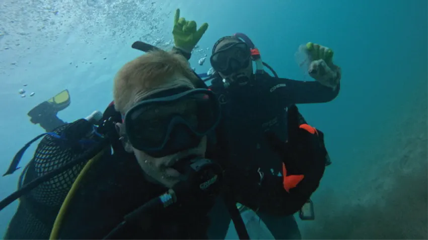 An underwater photograph of two people scuba diving