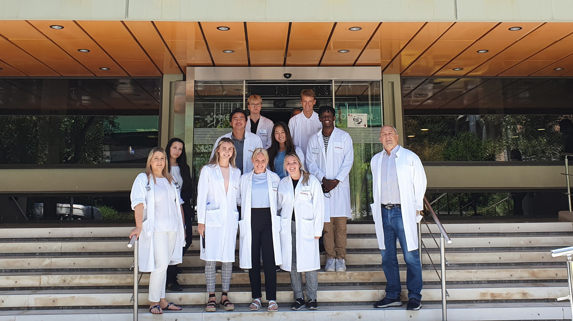 Medical students standing outside a hospital in Athens with their medical supervisor, intern abroad in Greece