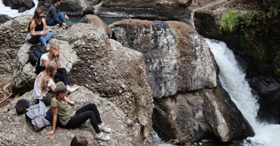 Interns relaxing at a waterfall in Costa Rica