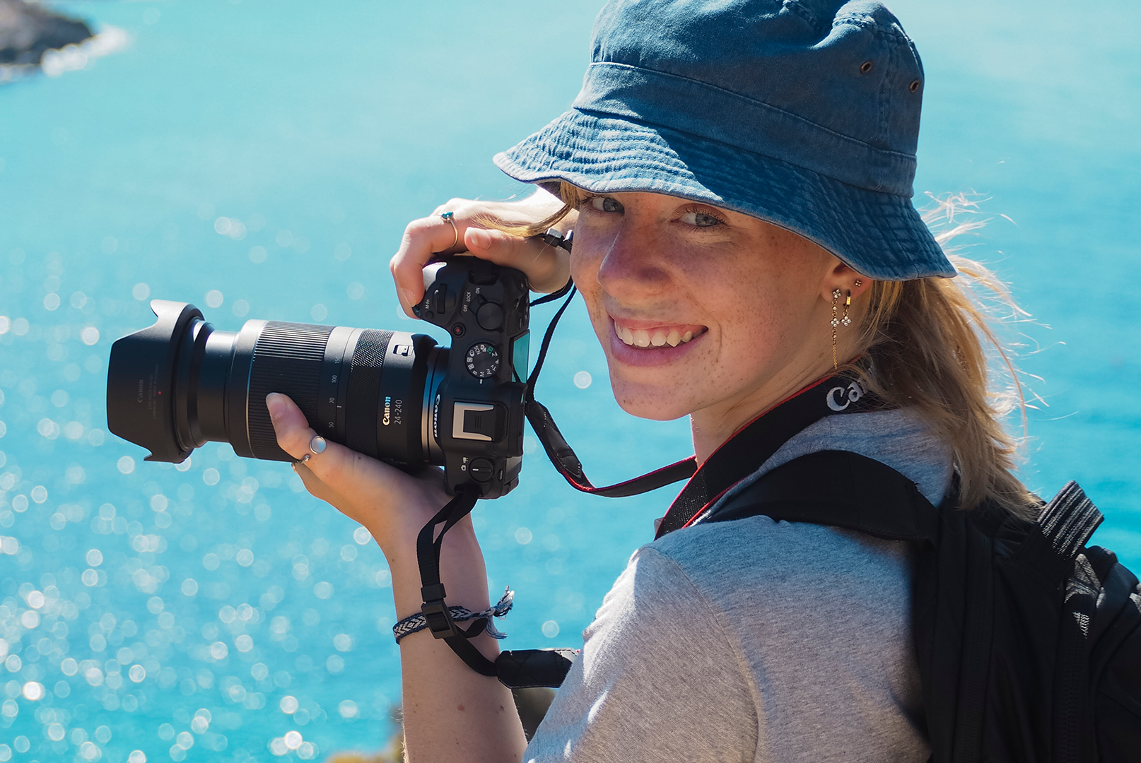 Marine Conservation Research Expedition a smiling researcher is holding a camera