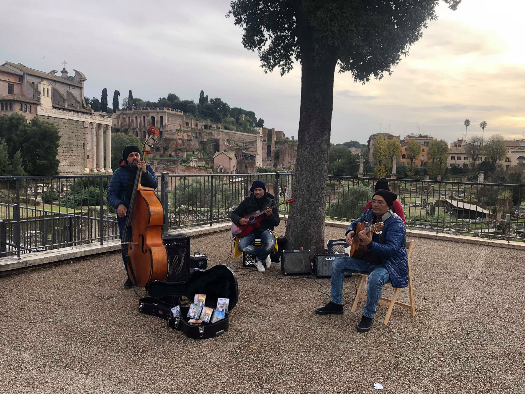 Street musicians play outside the colosseum and Roman Forum, Intern Abroad HQ