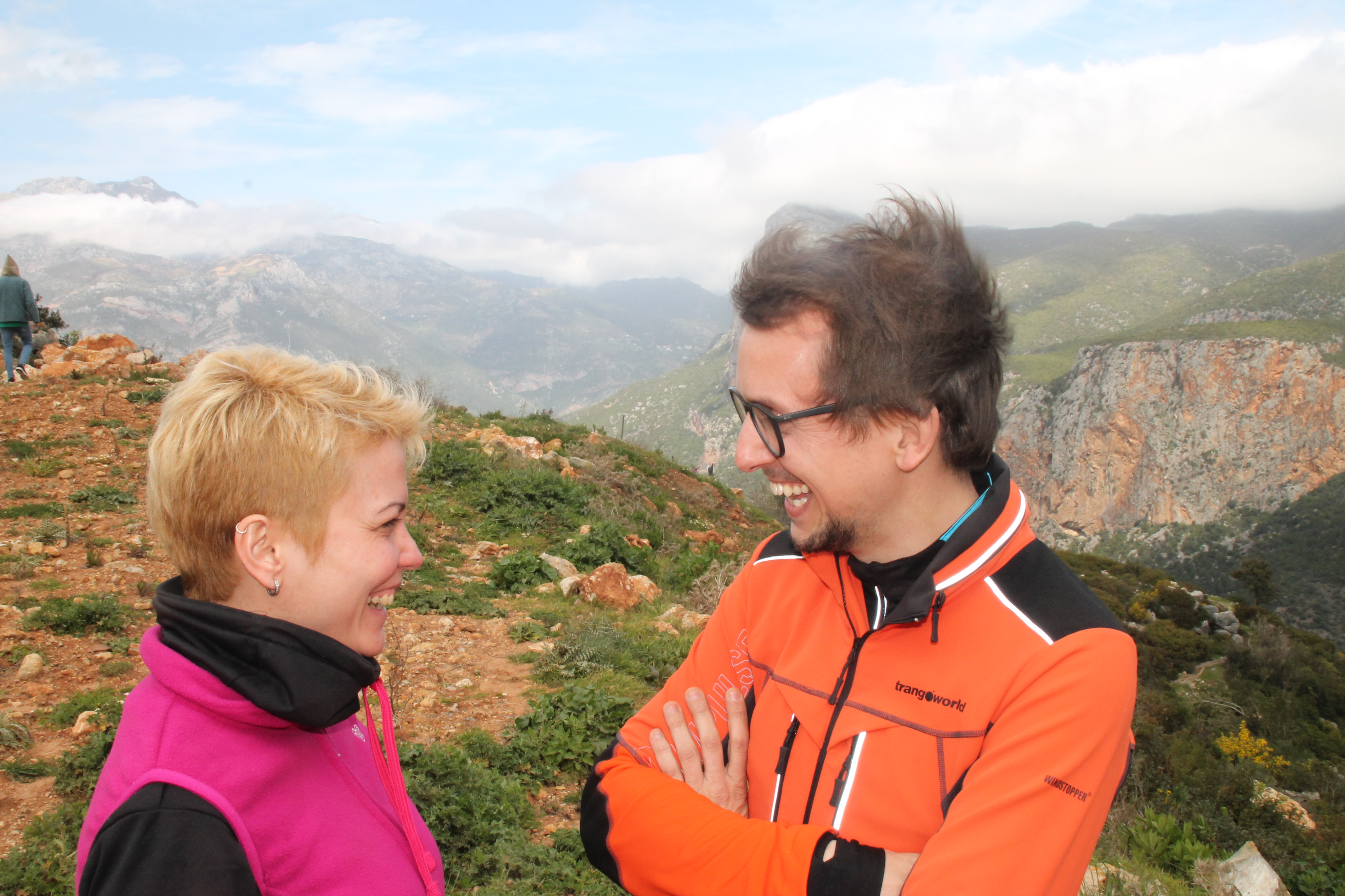 Two people in Morocco standing with the Rif mountains landscape in the background