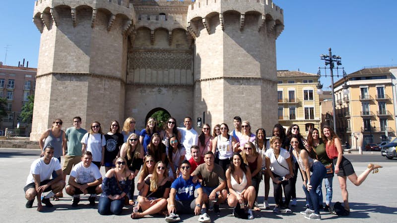 Interns in front of castle in Valencia