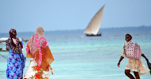 Women and children on the beach in Zanzibar, Intern Abroad HQ
